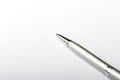 Metal roller pen over blank paper sheet note pad Royalty Free Stock Photo