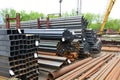 Metal rolling. Round and square tube are stacked in storage and loading at the warehouse.