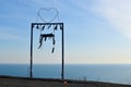 Metal romantic swing on the mountain above the cliff. dramatic natural landscape with swing