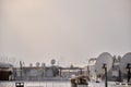 Metal roof  chimneys and satellite dishes Royalty Free Stock Photo