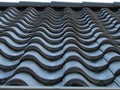 Metal roof tile. Roof tile in line. Row of black tile. Royalty Free Stock Photo