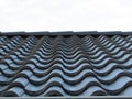 Metal roof tile. Roof tile in line. Row of black tile. Royalty Free Stock Photo