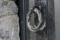 Metal Round Handle on Medieval Black Wooden Door Royalty Free Stock Photo