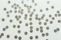 Metal round needle buttons scattered