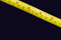 Metal ruler, Tape measure centimeters and millimeters on the yellow ruler Royalty Free Stock Photo