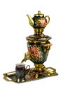 Metal Russian samovar, with traditional ornaments and paintings. On a white background