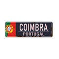 Metal rustet road sign with the name of Coimbra city from Portugal