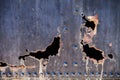 Metal with rusty hole and flaking paint Royalty Free Stock Photo