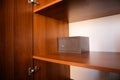 Metal safe inside an empty wooden closet in a hotel room Royalty Free Stock Photo