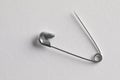 Metal safety pin on white background, top view Royalty Free Stock Photo