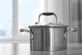 Metal saucepan on table Royalty Free Stock Photo