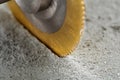 Metal saw, end mill or drill bit with diamond coating makes hole in concrete slab. Industry and construction Royalty Free Stock Photo