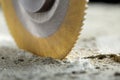 Metal saw, end mill or drill bit with diamond coating makes hole in concrete slab. Industry and construction Royalty Free Stock Photo