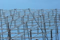 Metal scaffolding against blue sky background