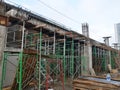 Metal scaffolding is used as a temporary structure that supports works at the construction site.