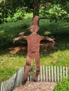 Metal scarecrow decoration outdoors in garden