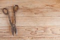 Metal scissor on wooden background