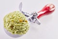 Metal scoop full of pistachio ice cream Royalty Free Stock Photo