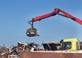 Metal scrap yard with grabber Royalty Free Stock Photo
