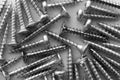 Metal screws over technical drawing close-up Royalty Free Stock Photo