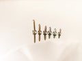 Yellow hardware screws on a white background