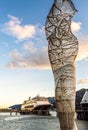 Metal sculpture on dock with cruise ships, late afternoon. Juneau, Alaska, USA. Royalty Free Stock Photo