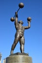 Metal sculpture featuring a strong man in a circus in Astana