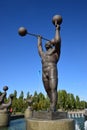 Metal sculpture featuring a strong man in a circus in Astana