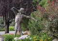 Metal sculpture of an Indian archer standing in a garden in Edwards, Colorado.