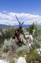 Metal sculpture of a spear fisher and his dog Royalty Free Stock Photo