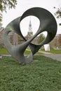 A metal sculpture stands in front of the Baker Tower on the campus of Dartmouth College in Hanover, New Hampshire