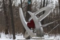 Metal sculpture in the winter wood Royalty Free Stock Photo