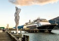 Metal sculptures on dock with cruise ships, late afternoon. Juneau, Alaska, USA. Royalty Free Stock Photo