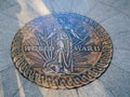 Metal seal in floor at war memorial