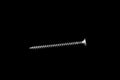 Metal self-tapping screw on black isolated background