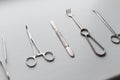 Metal set of medical instruments scalpel blade, scissors, forceps, clamps, forceps on a white background in the room. Modern Royalty Free Stock Photo