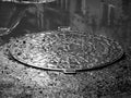 Metal sewage cover in the flooded city,
