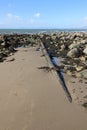 Sewer outfall pipe on Welsh beach Royalty Free Stock Photo