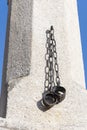 Metal shackles hang from a concrete pillar of shame, chaining people in old Europe Austria, Retz, Royalty Free Stock Photo