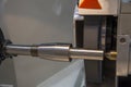 The metal shaft on the cylindrical grinding machine.