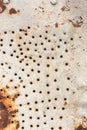 Metal sheet texture with holes and rust Royalty Free Stock Photo