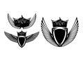 Heraldic shield with royal crown and spread eagle wings black and white vector design set Royalty Free Stock Photo