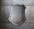 Metal shield over armor plates background Royalty Free Stock Photo