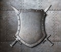 Metal shield and two crossed swords coat of arms