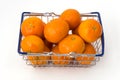 Metal shopping basket filled with clementines