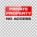 Metal sign PRIVATE PROPERTY on metal wire fence Royalty Free Stock Photo