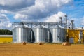 Metal silos on agro manufacturing plant for processing drying cleaning and storage of agricultural products, flour, cereals and Royalty Free Stock Photo