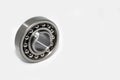 Metal silver ball bearing with balls on white isolated background. Bearing industrial. Part of the car Royalty Free Stock Photo