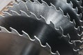 Metal silver circular saw blades for wood work as industrial tool background