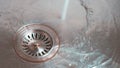 Metal Sink with Water in Drain Royalty Free Stock Photo